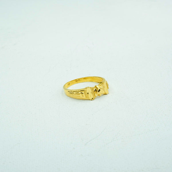 Gold ring with detailed carvings