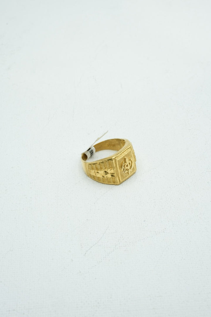 Designer gold ring with intricate carvings
