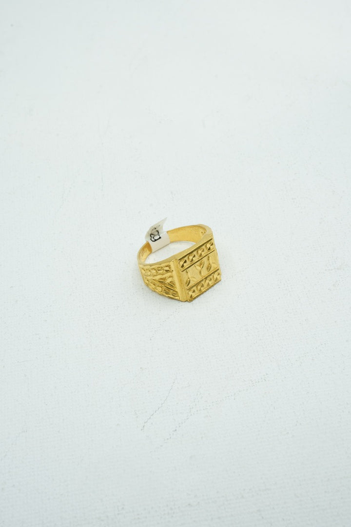 Designer gold ring with intricate carvings