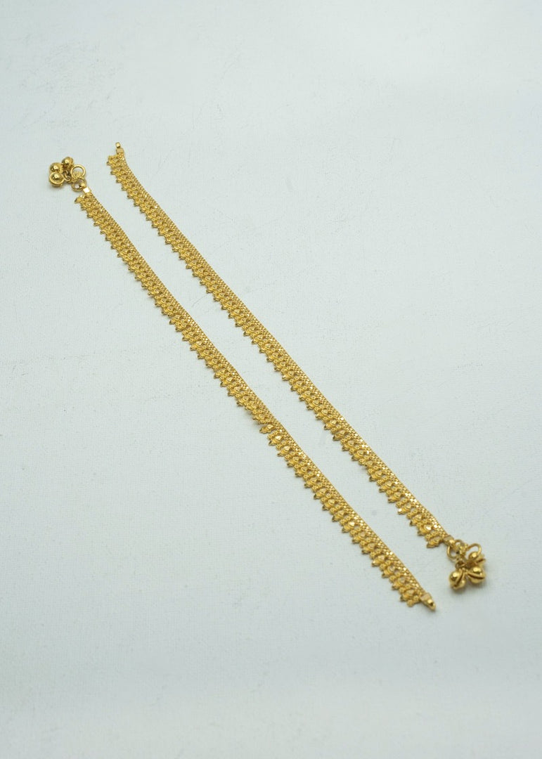 Ethnic and beautifully carved pair of yellow-gold anklets