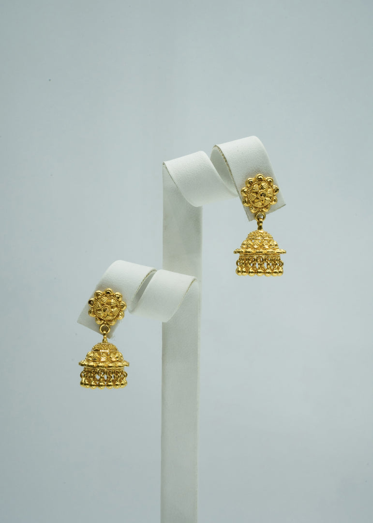 Gold jhumka with a floral design earings