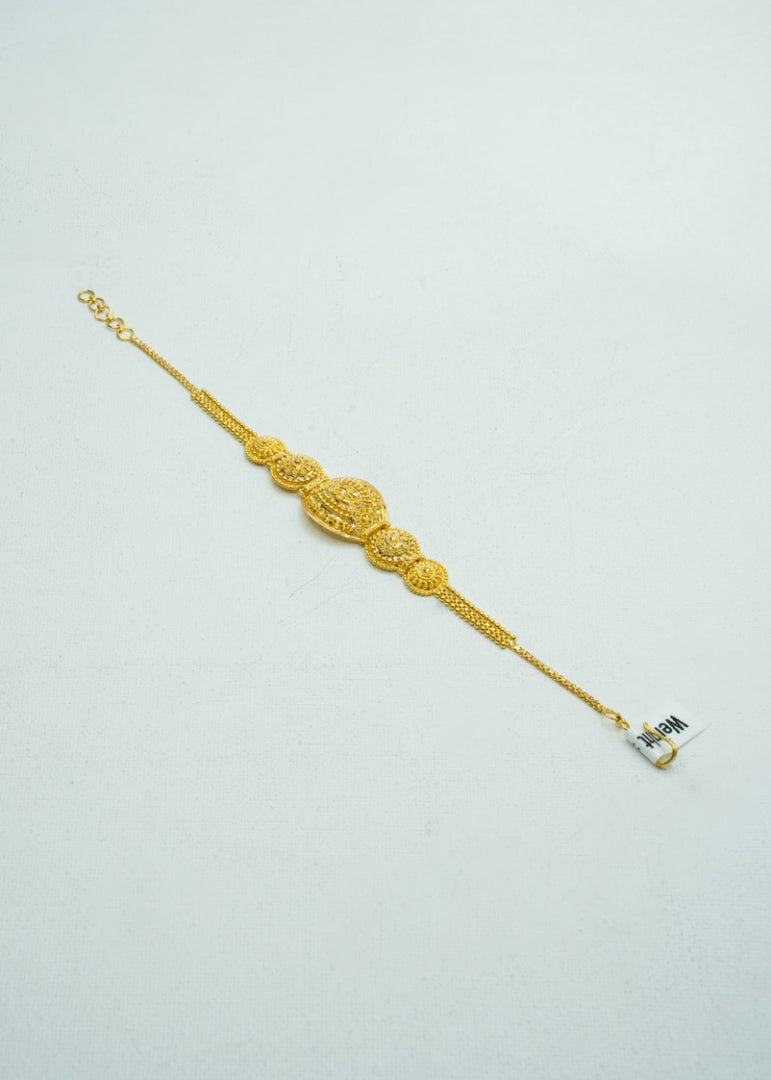 Stunning yellow-gold bracelet with traditional design and intricate carvings