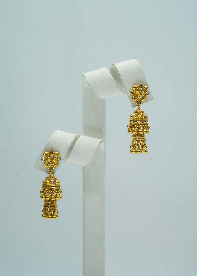 Two-toned sunburst double tiered yellow and white gold jhumka earrings