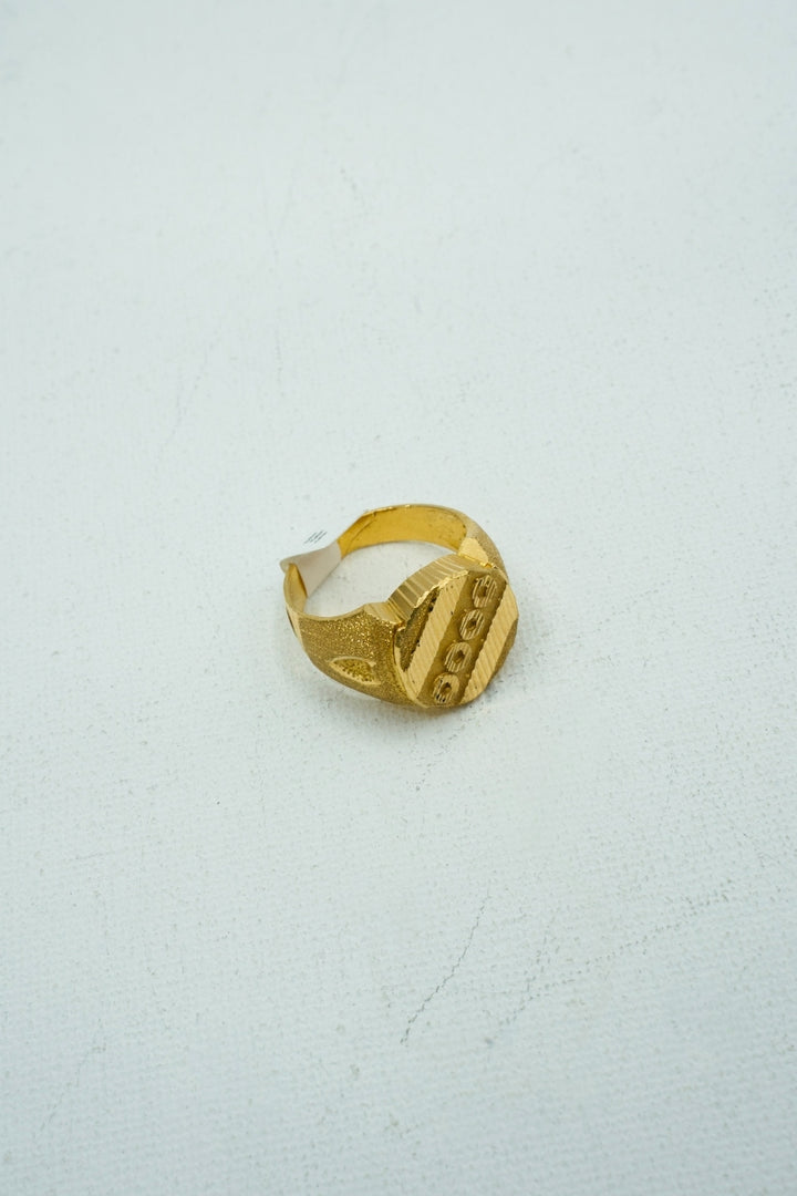 Understated yellow gold signet ring with engravings
