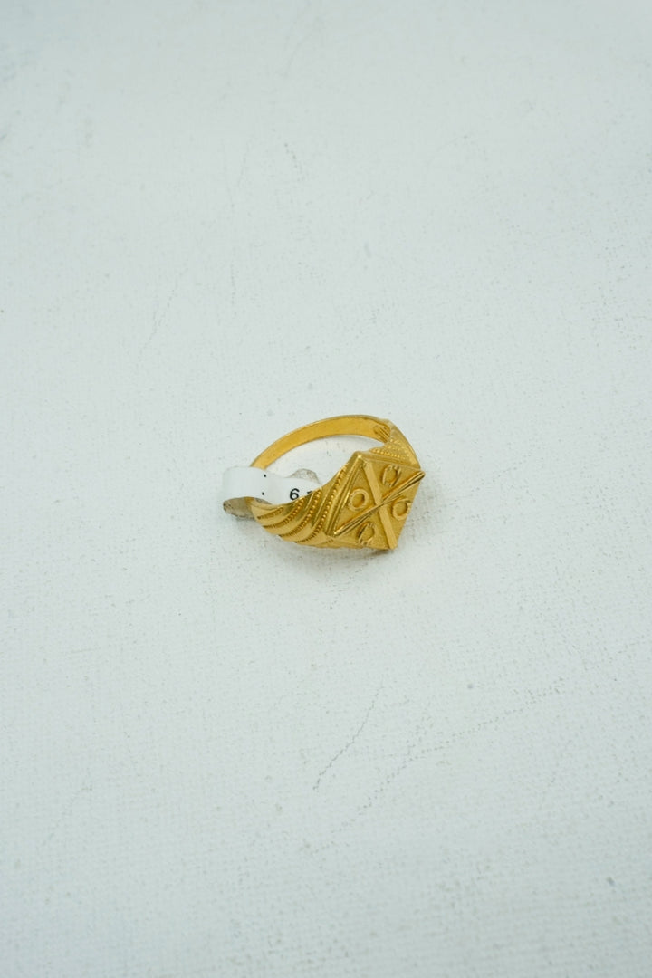 Yellow-gold ring with textured intricate engravings