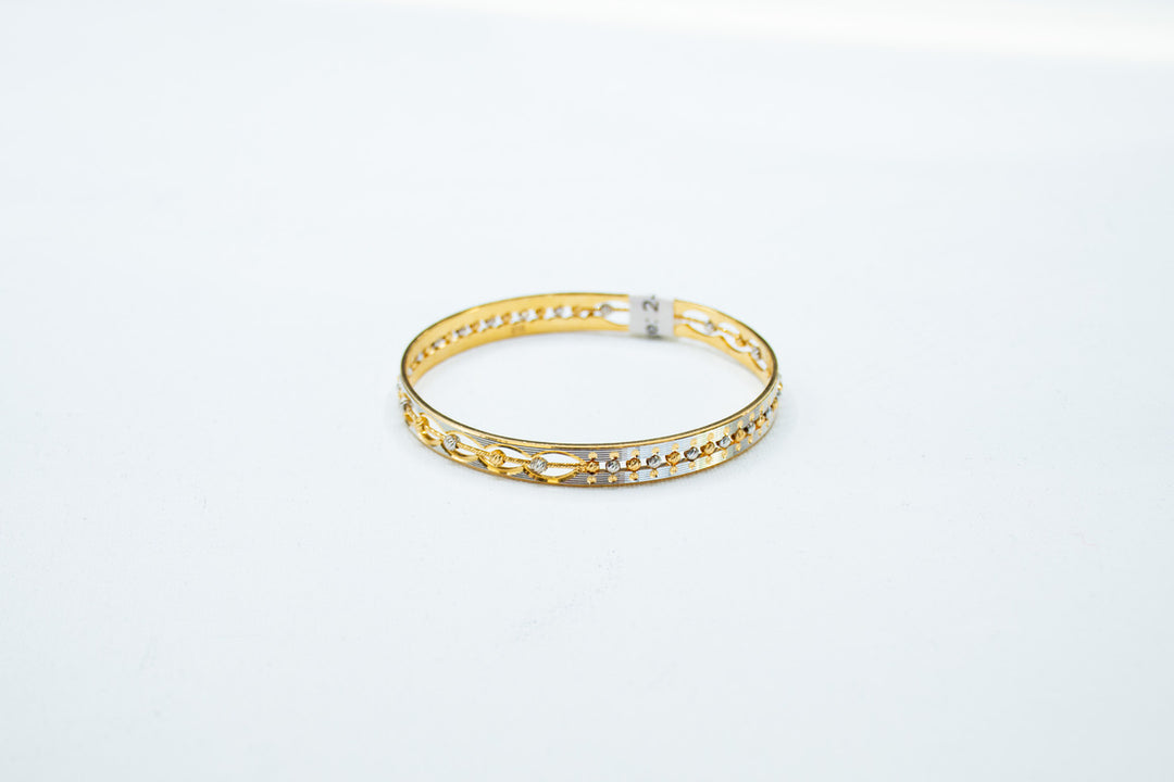Slim two-toned gold bangle