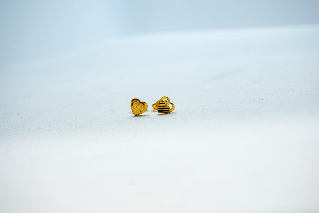 Designer heart gold stud earrings