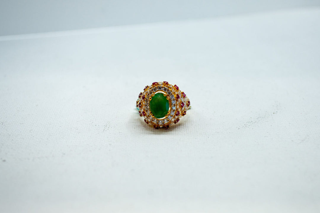 Emerald and zircon-encrusted halo ring-