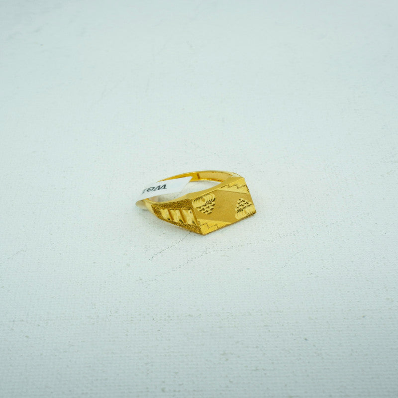 Bright yellow gold ring in square with textured engravings