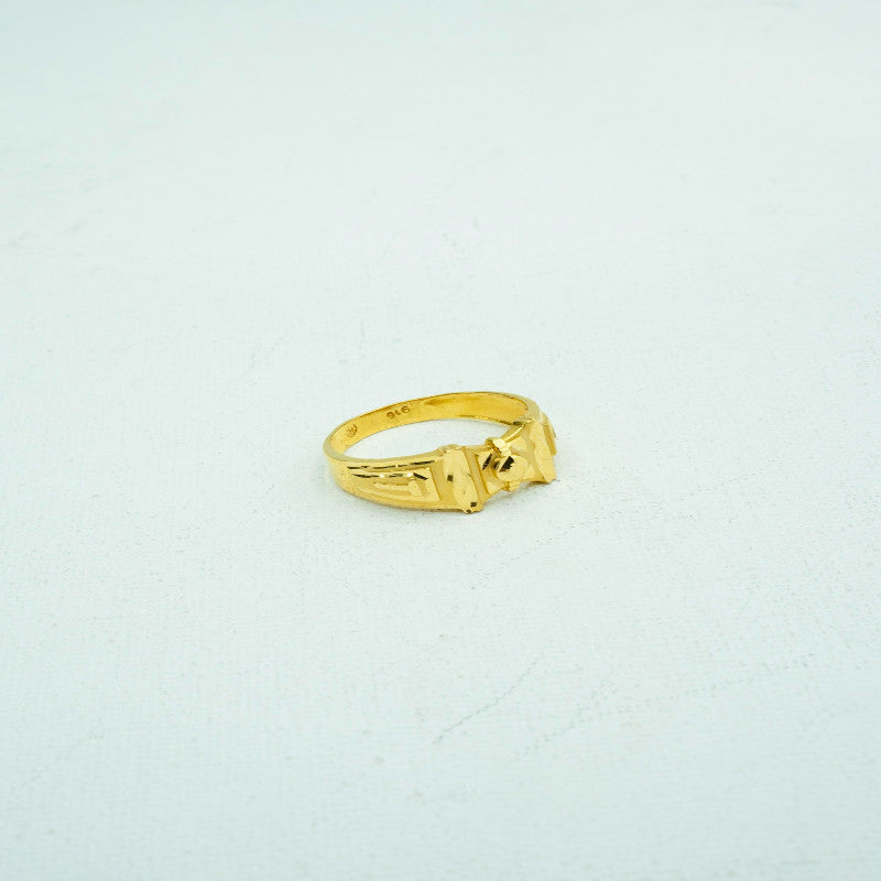 Bright yellow gold ring with detailed carvings