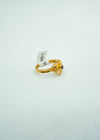 Dainty gold ring with self-carvings and small coloured stone centre.