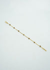 Delicate gold bracelet with coloured stones