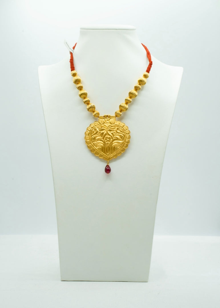 Ethnic heavy gold necklace with beautifully carved pendant