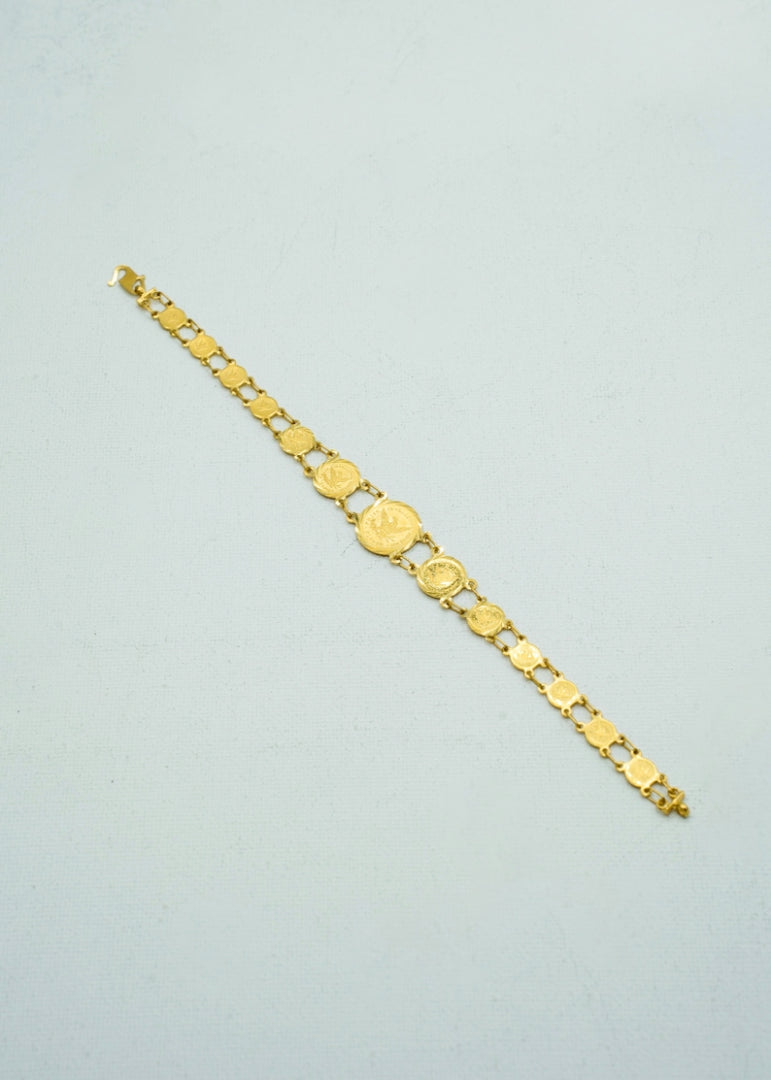 Feminine yellow-gold coin bracelet in wrist watch shape