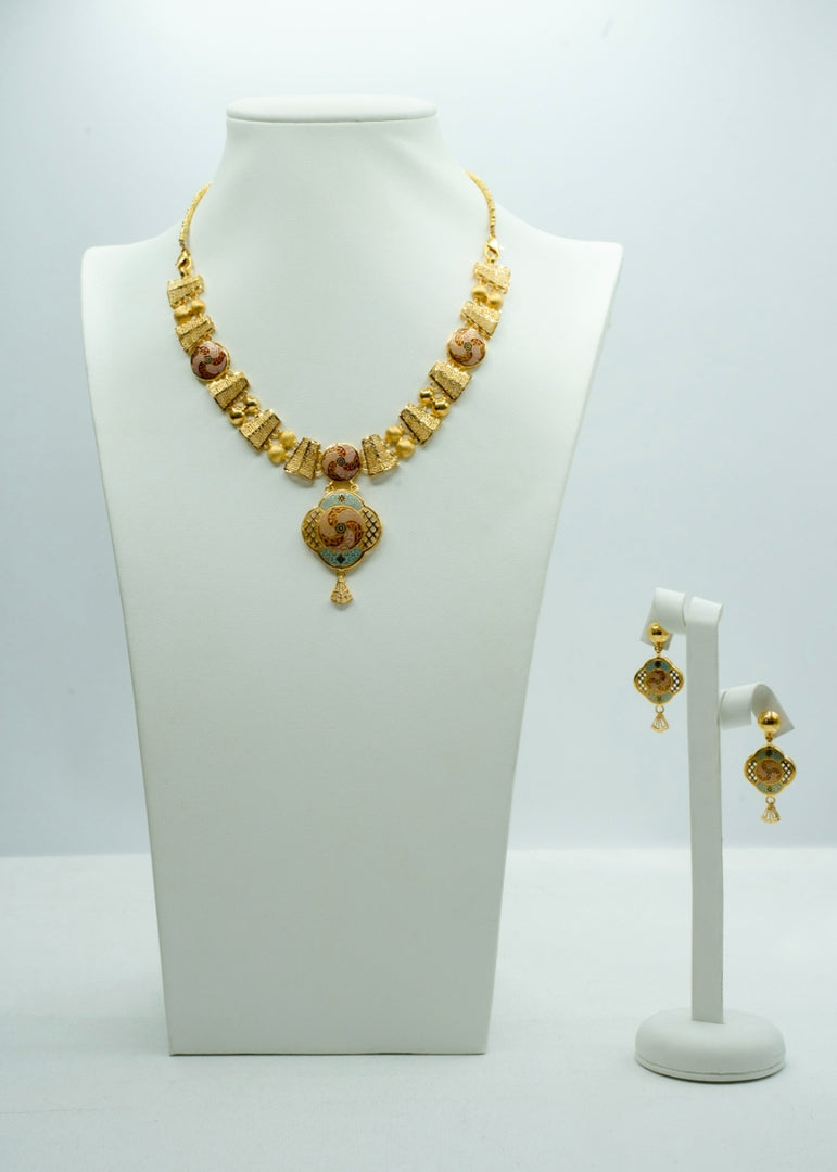 Finely crafted geometrical designer gold neckpiece with matching earrings