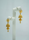 Floral-styled bright gold two-tiered jhumka earings
