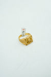 Gleaming gold square-signet textured ring with star embossing at the center.