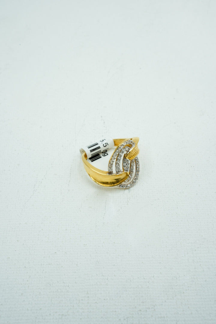 Gold clawed diamond encrusted concentric ring