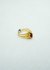 Gold ring with centre coloured stone