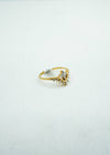 Intricate and dainty diamond-encrusted gold ring