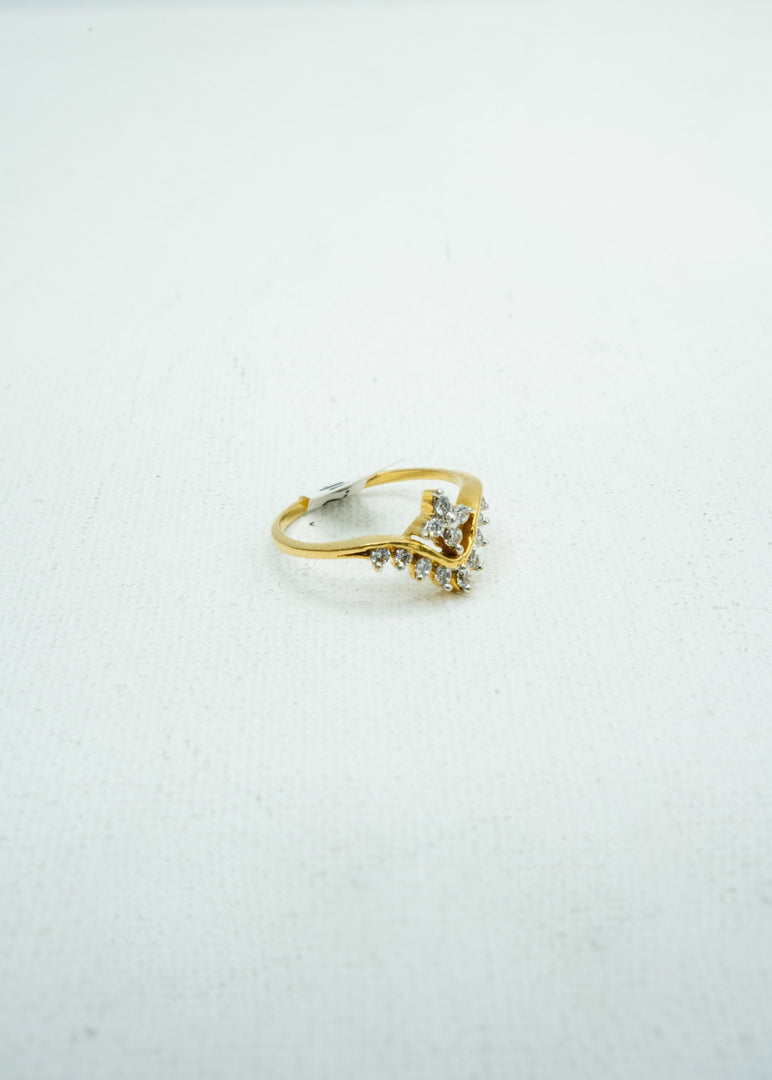 Intricate and dainty diamond-encrusted gold ring