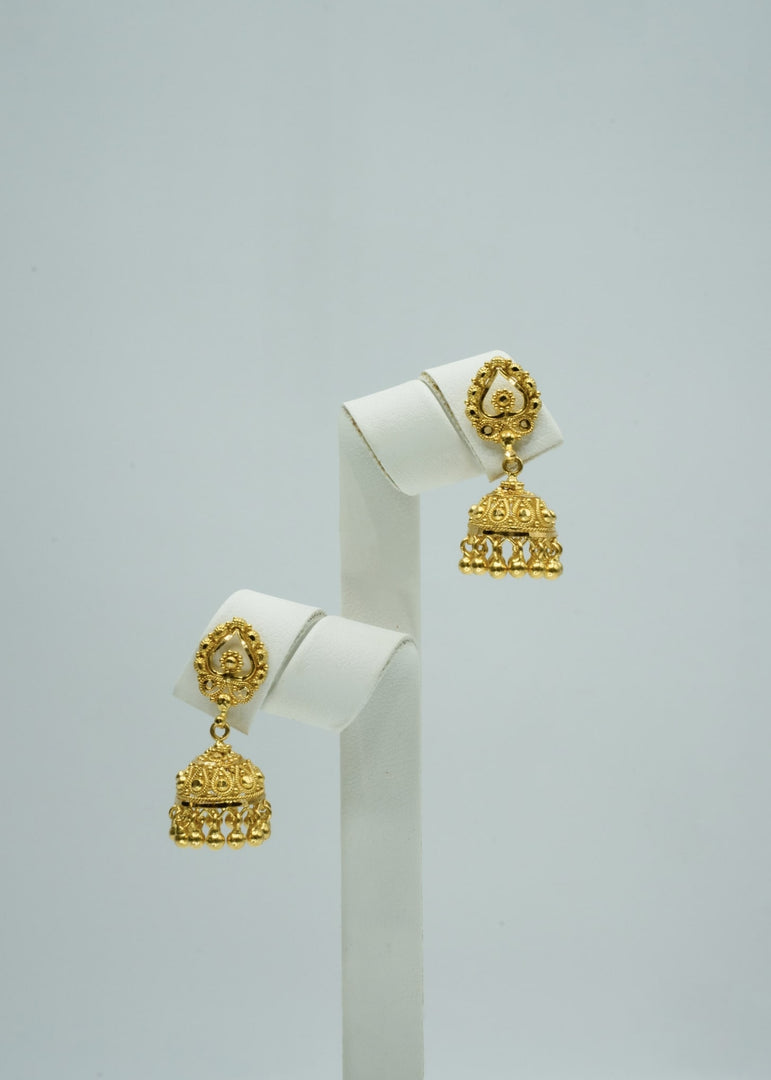 Intricately designed small gold jhumki earrings