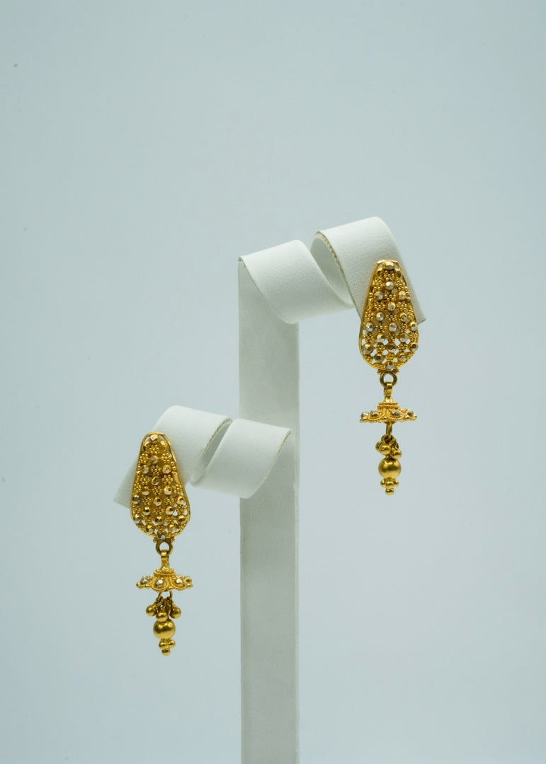 Pear shaped long drop earrings in yellow gold