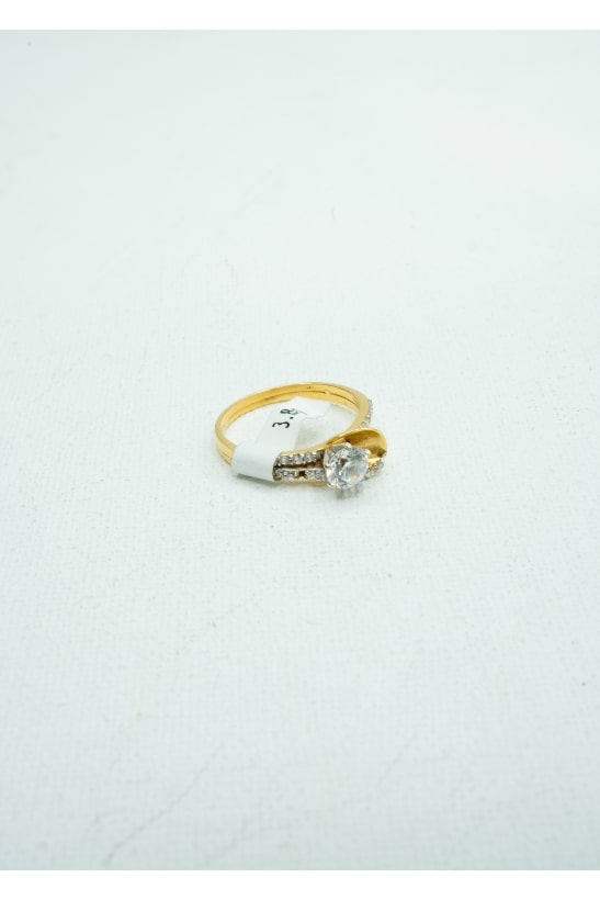 Round solitaire diamond with gold leaf with diamond crusts half band gold ring