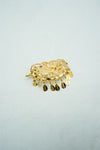 Traditional bright gold tika with nakaashi and trinkets