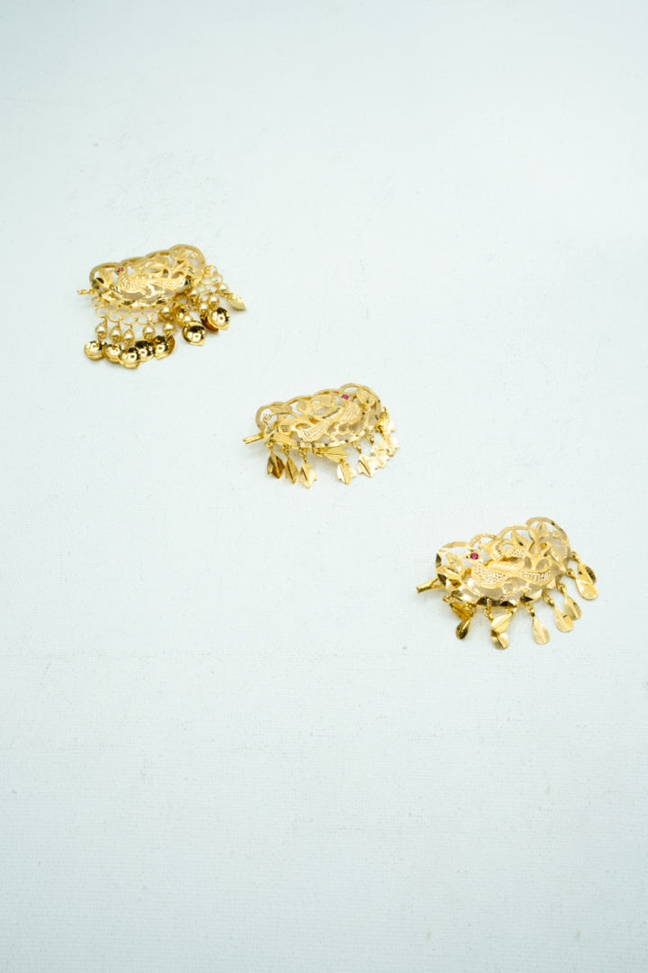 Traditional gold trinkets with jaali work