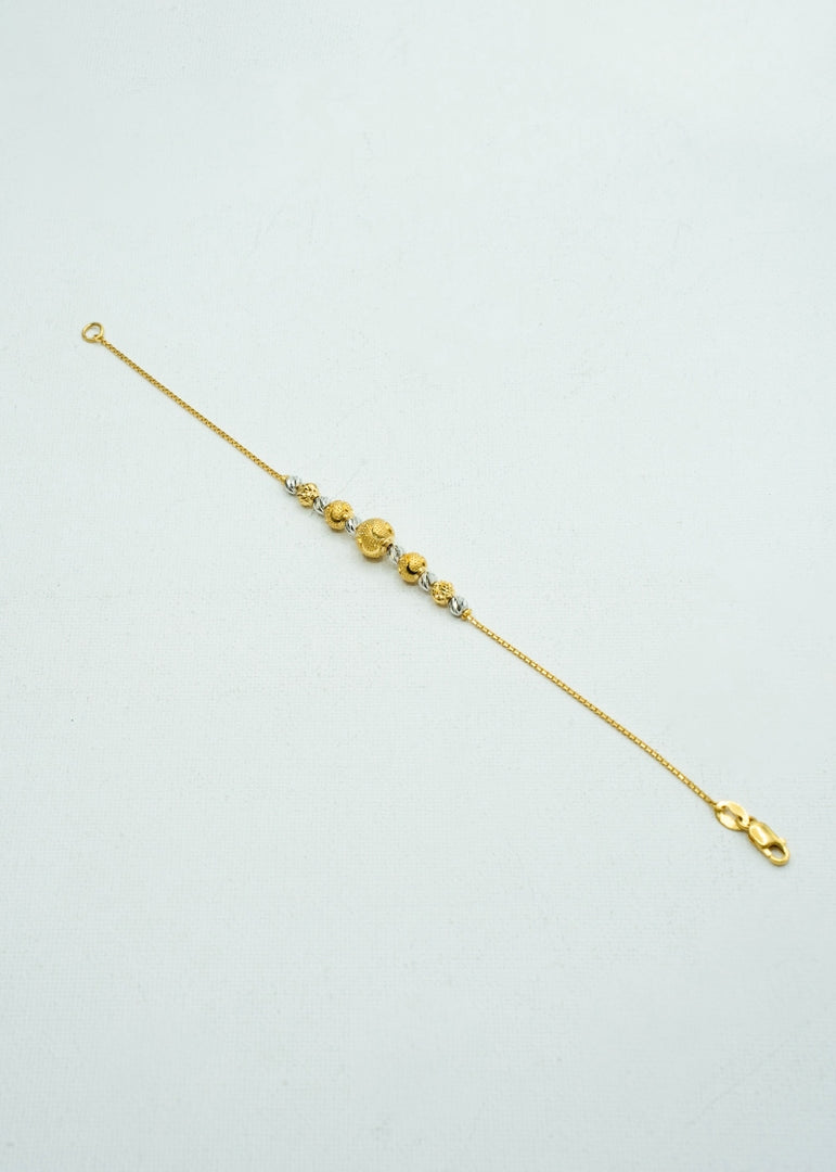 Two-toned delicate yellow and white gold beaded bracelet