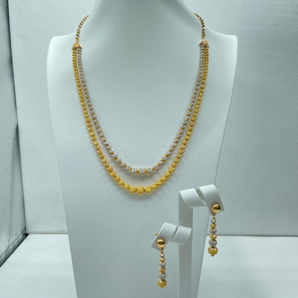 Contemporary white and yellow gold necklace set