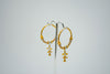Ethnic yellow gold hoop earrings
