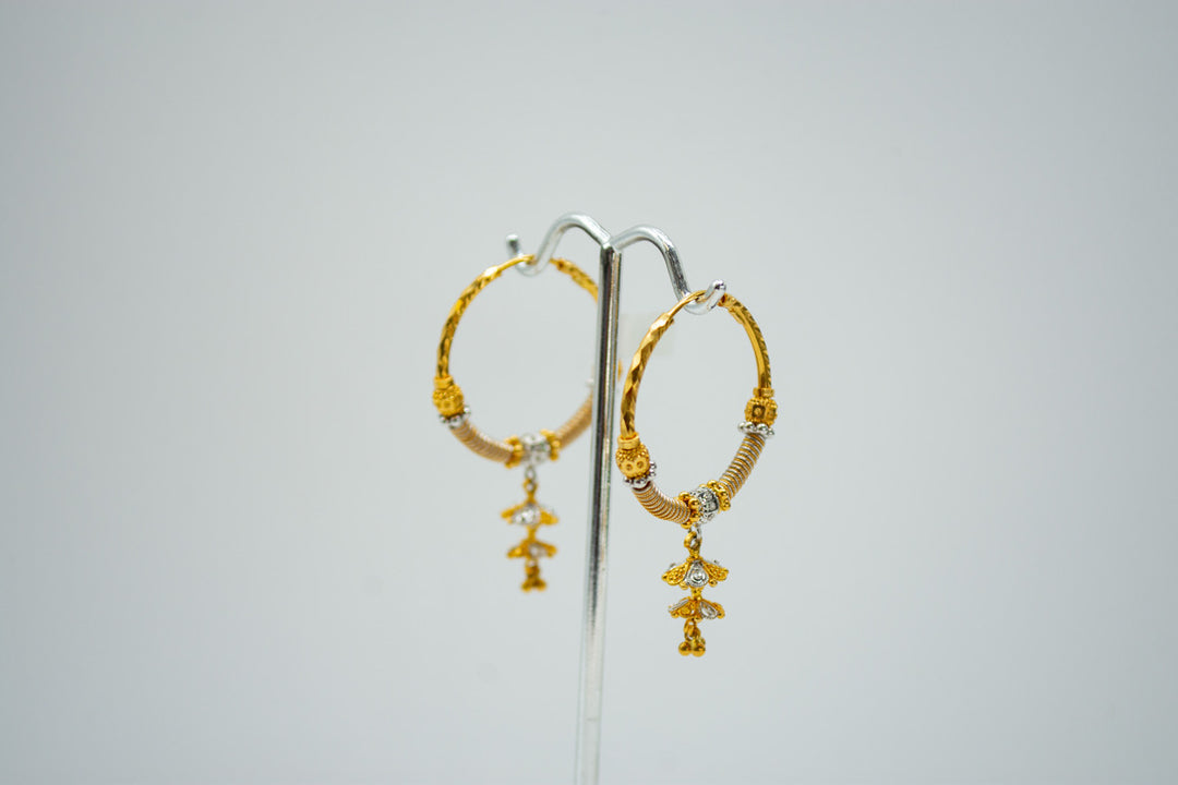 Ethnic yellow gold hoop earrings