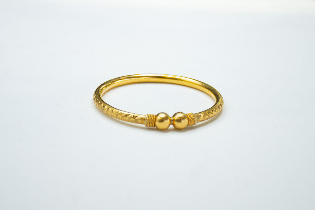 Lustrous gold kada bracelet