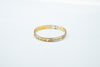 Slim two-toned gold bangle
