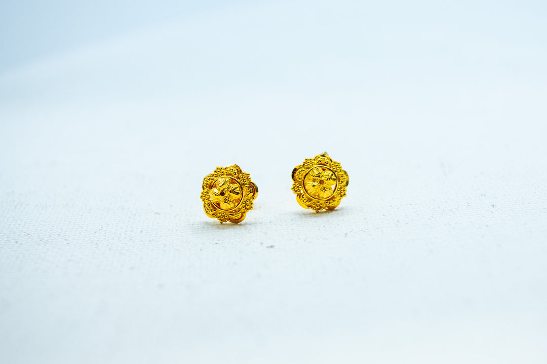 Yellow gold ethnic gold stud earrings