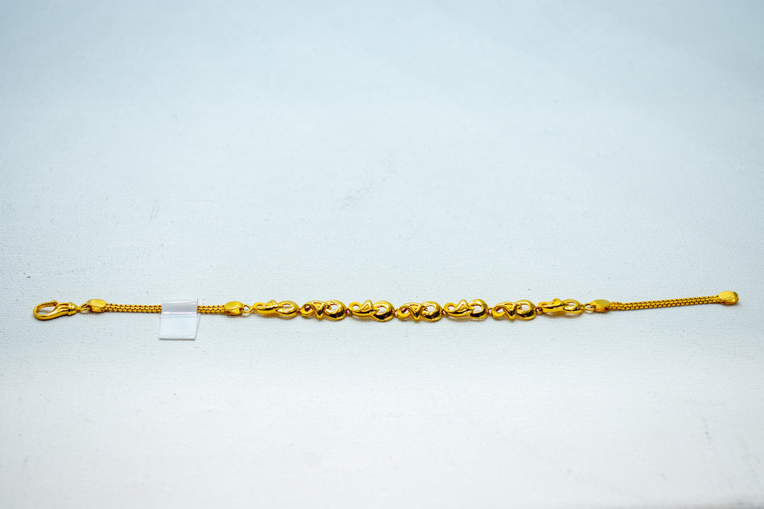 Yellow gold designer bracelet