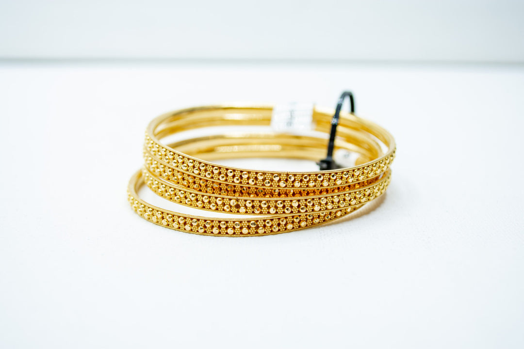 Finely crafted ethnic gold bangles set