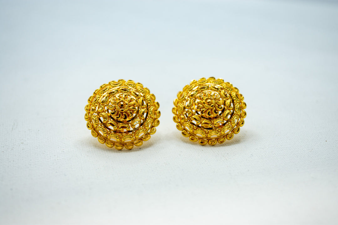 Intricately crafted gold earrings