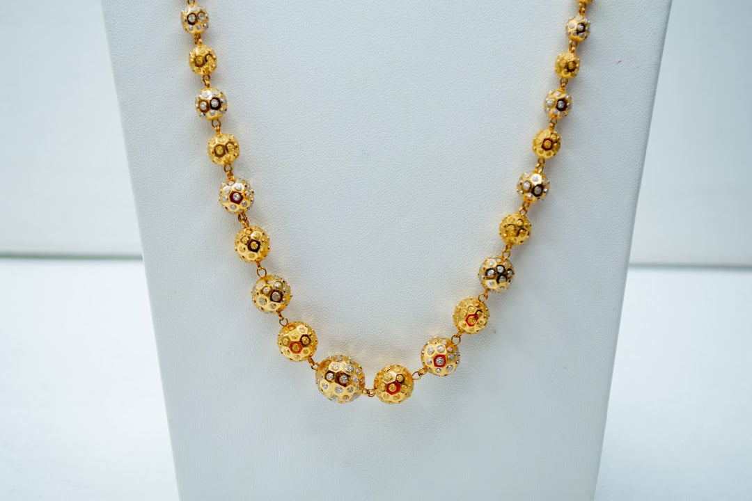 Imposing beaded gold chain
