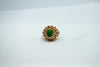 Emerald and zircon-encrusted halo ring-