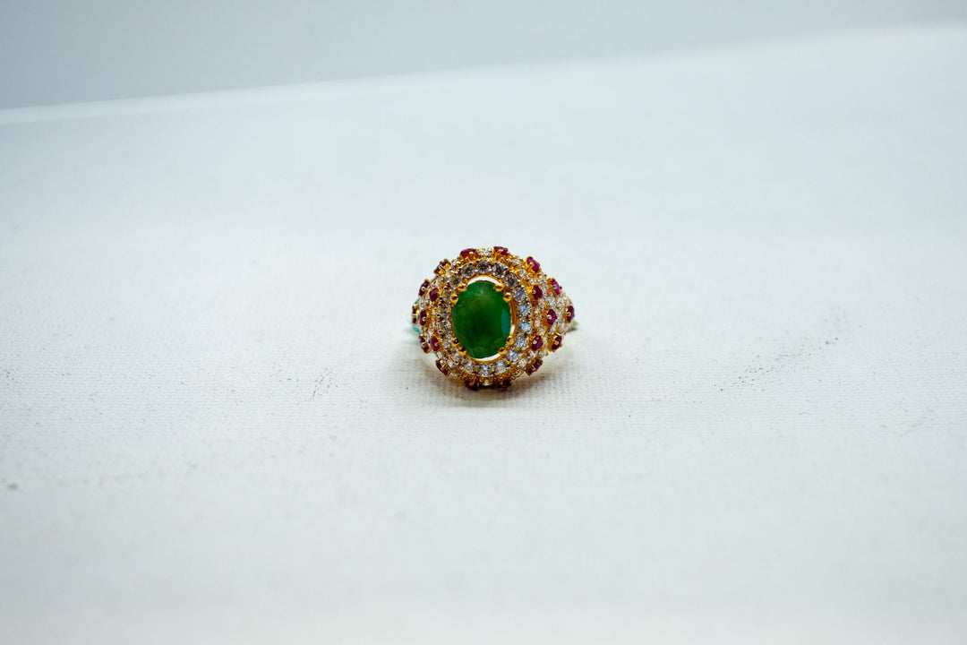 Emerald and diamond-encrusted halo ring